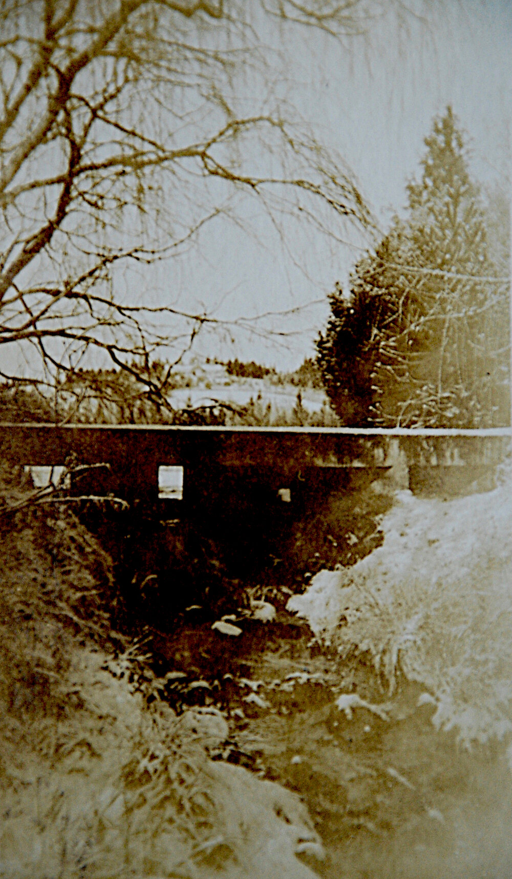 Sluicing Gate with Taylor Family Homestead in Distance
