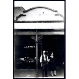 Photograph, Charles Naish & Daughter outside Store 