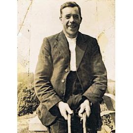J.A. Taylor and crutches, Ashley Downs, 1920