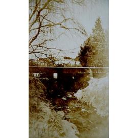 Sluicing Gate with Taylor Family Homestead in Distance